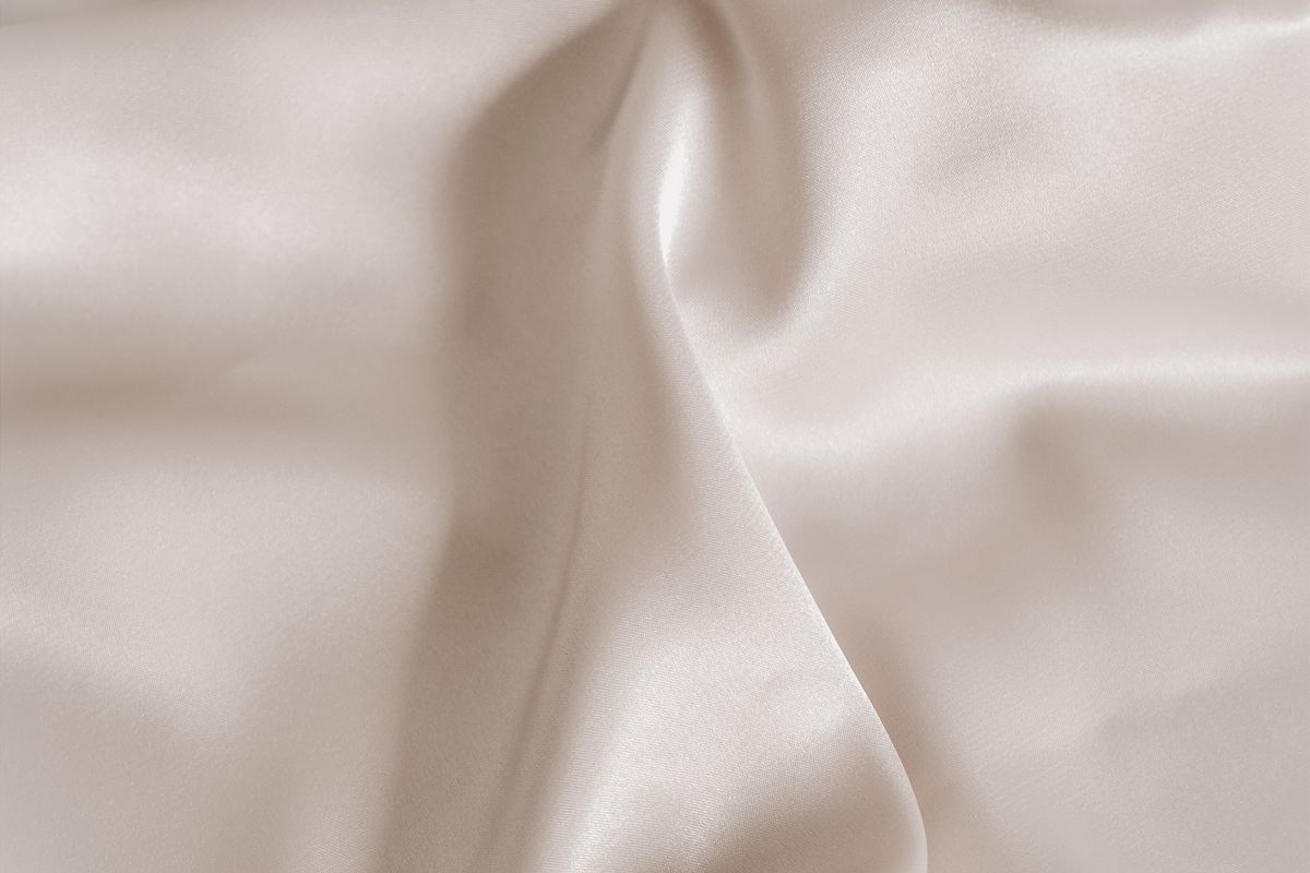 Pale smooth modal-style fabric in soft, silky folds